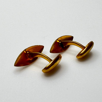 Side view of curved bar Edwardian-style gold cufflinks with floral engraving