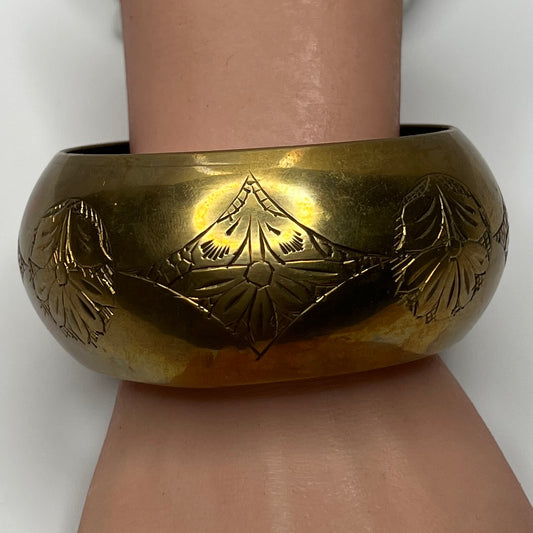 Vintage wide brass bangle bracelet with engraved floral design
