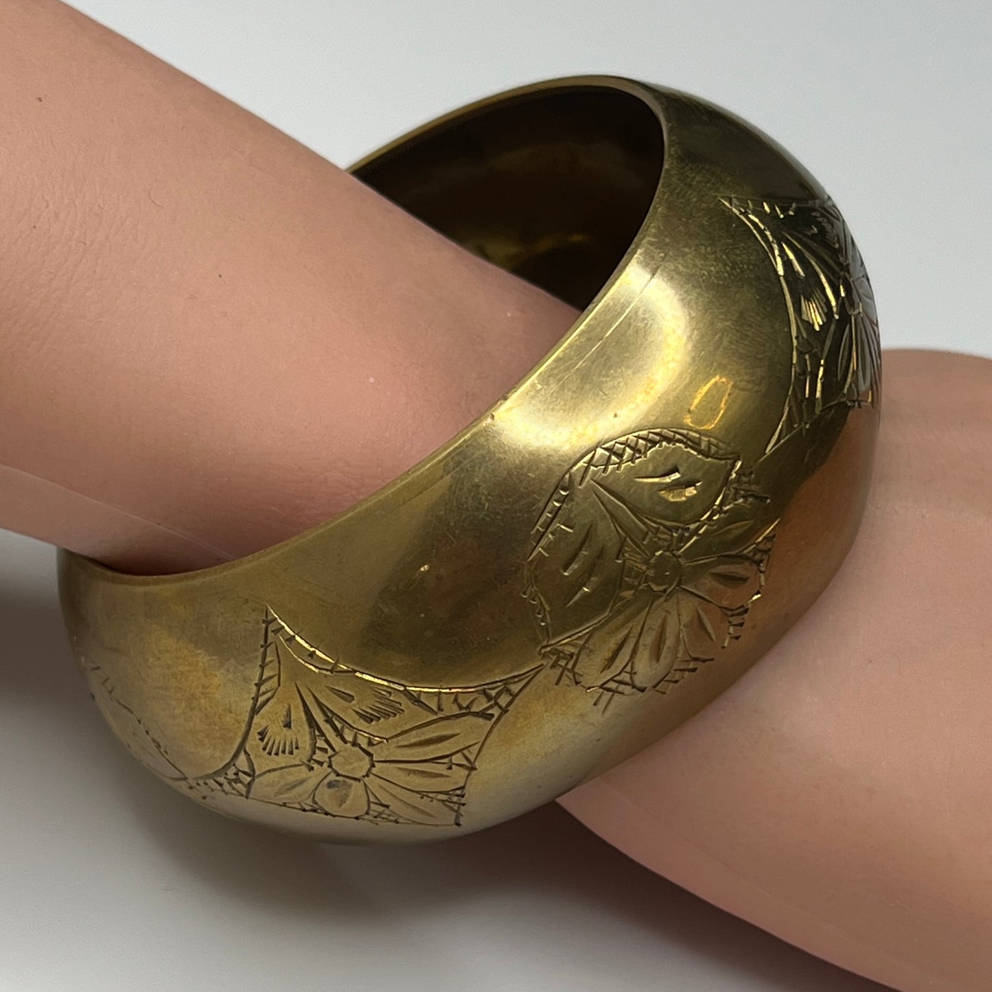 Vintage wide brass bangle bracelet with engraved floral design