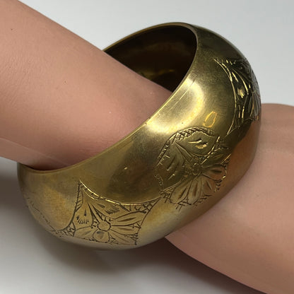 Vintage wide brass bangle bracelet with engraved floral design