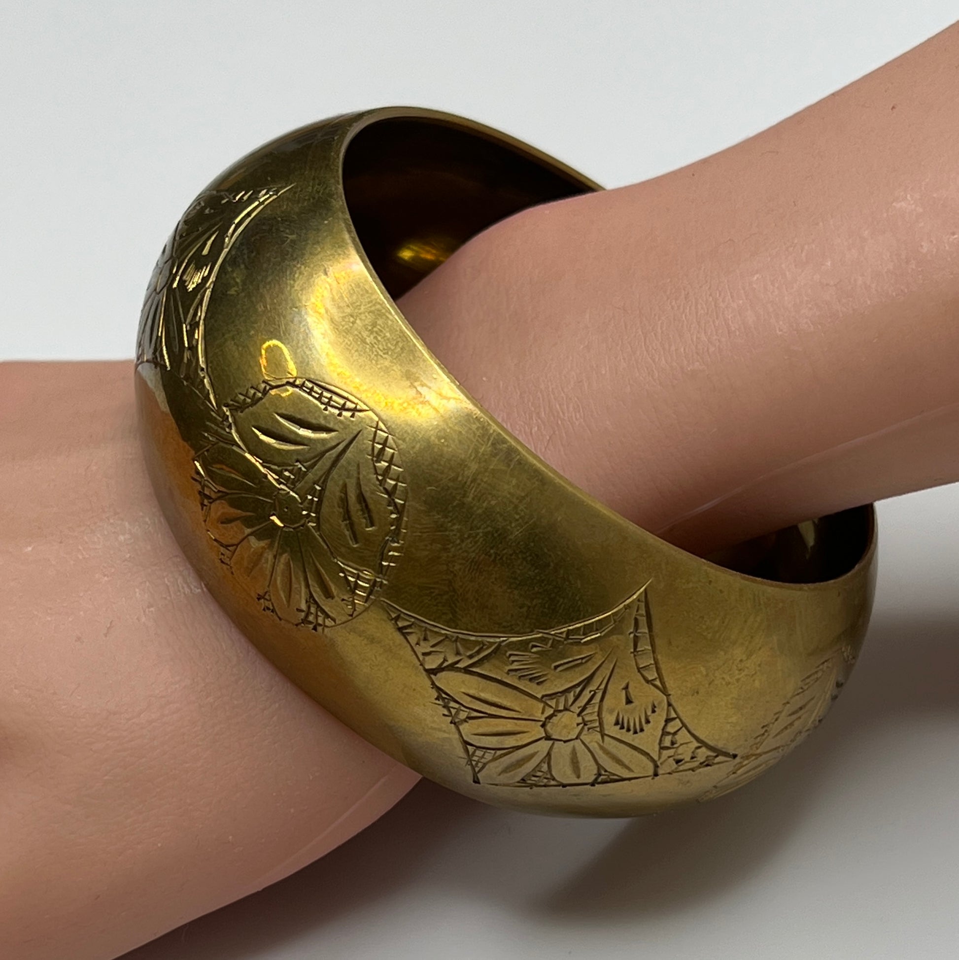 Vintage wide brass bangle bracelet with engraved floral design