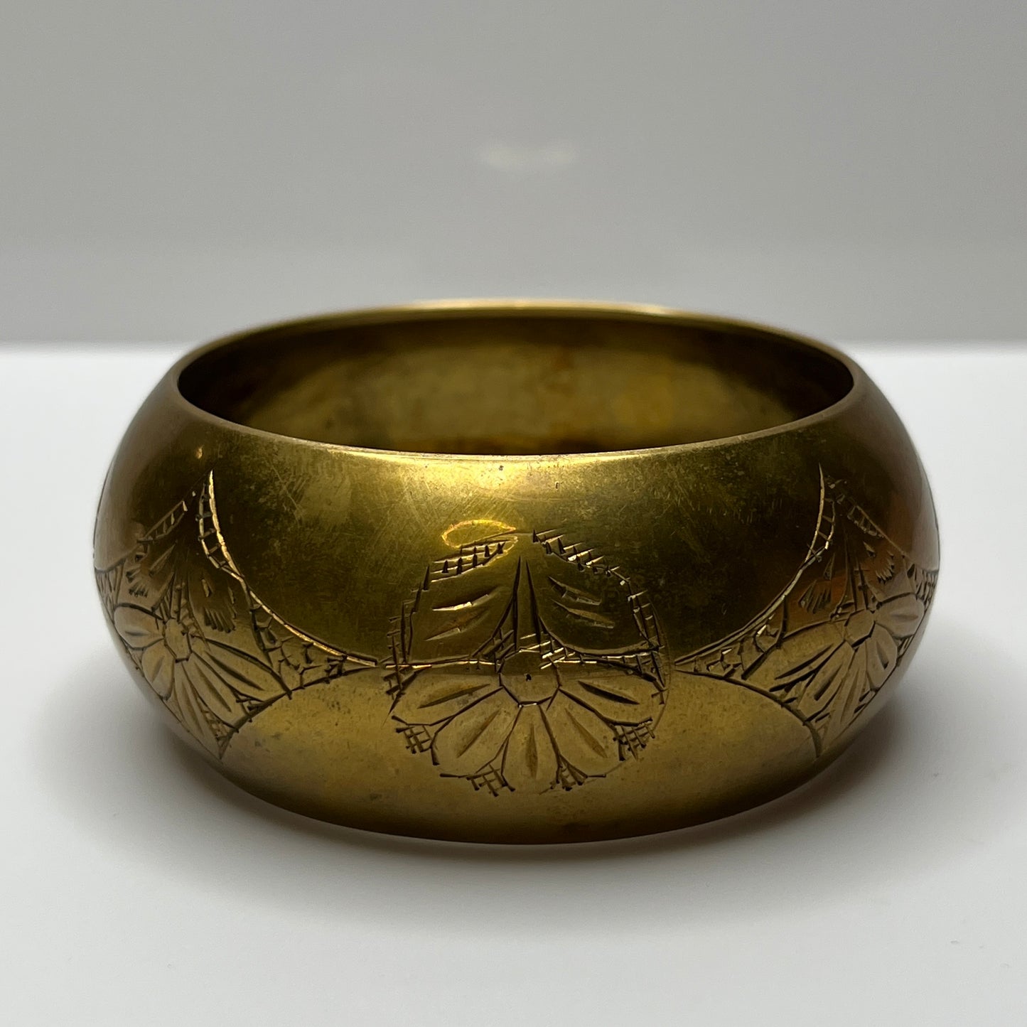 Chunky brass cuff with etched diamond and flower pattern