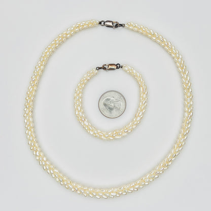 Pearl bracelet and necklace with quarter for size reference