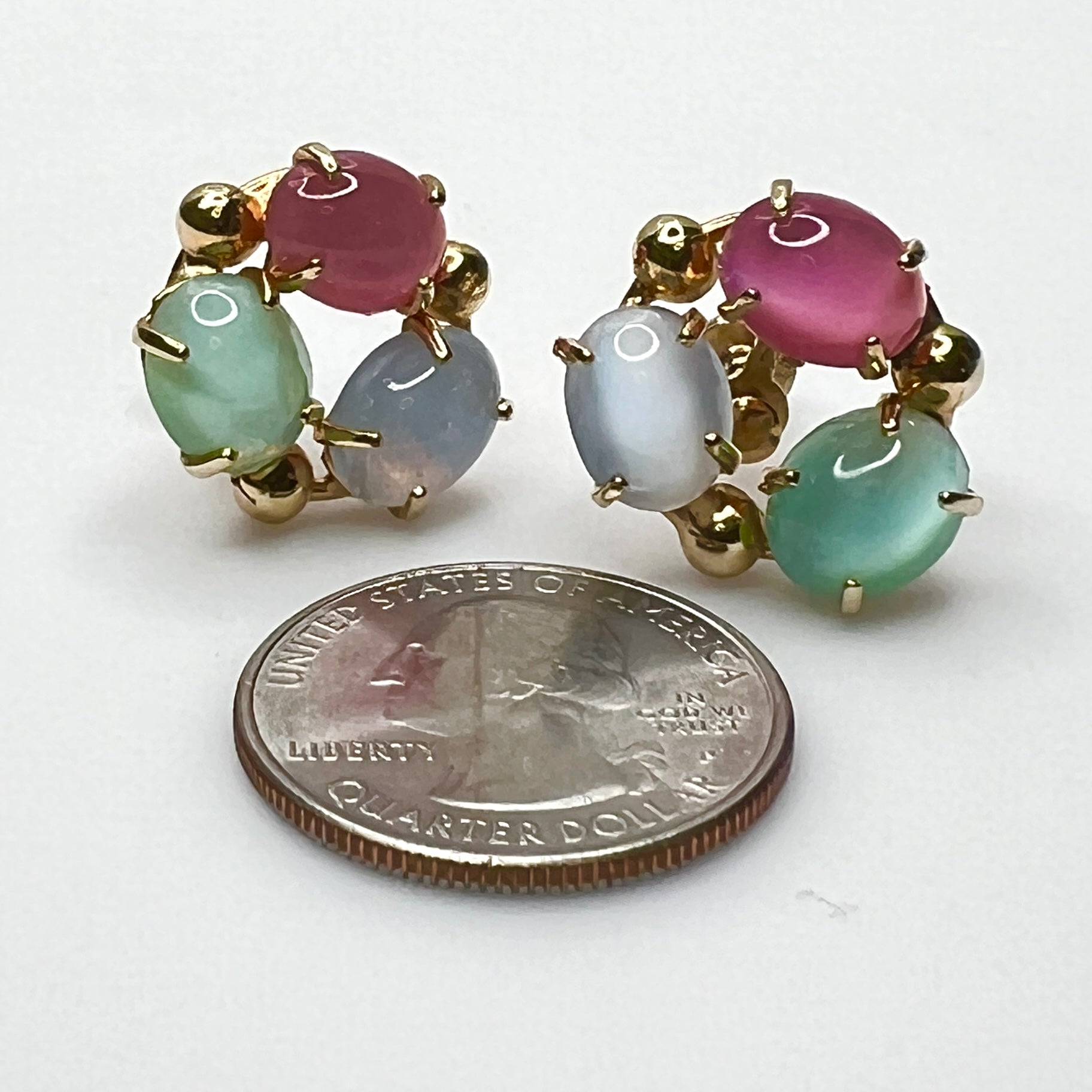 Mid-century pastel moonglow fruit salad screw back earrings with gold tone setting with quarter for scale