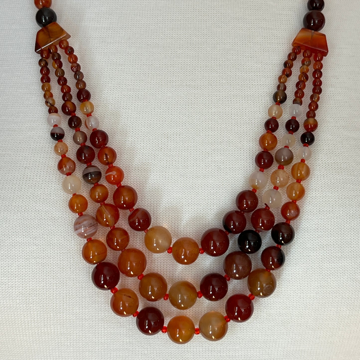 Triple strand vintage glass bead necklace in warm autumn tones