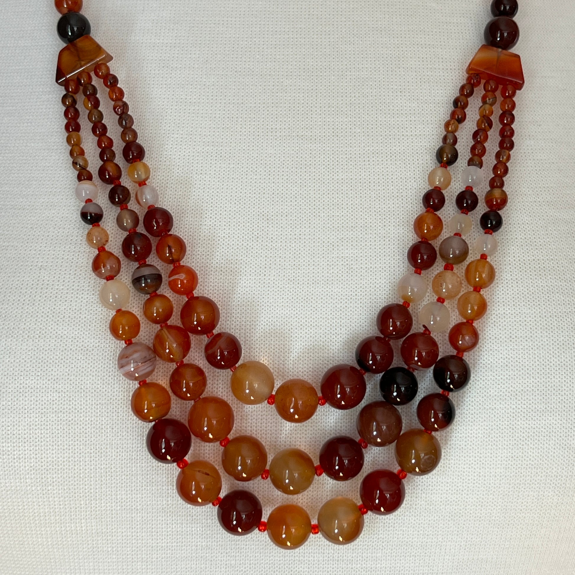 Triple strand vintage glass bead necklace in warm autumn tones