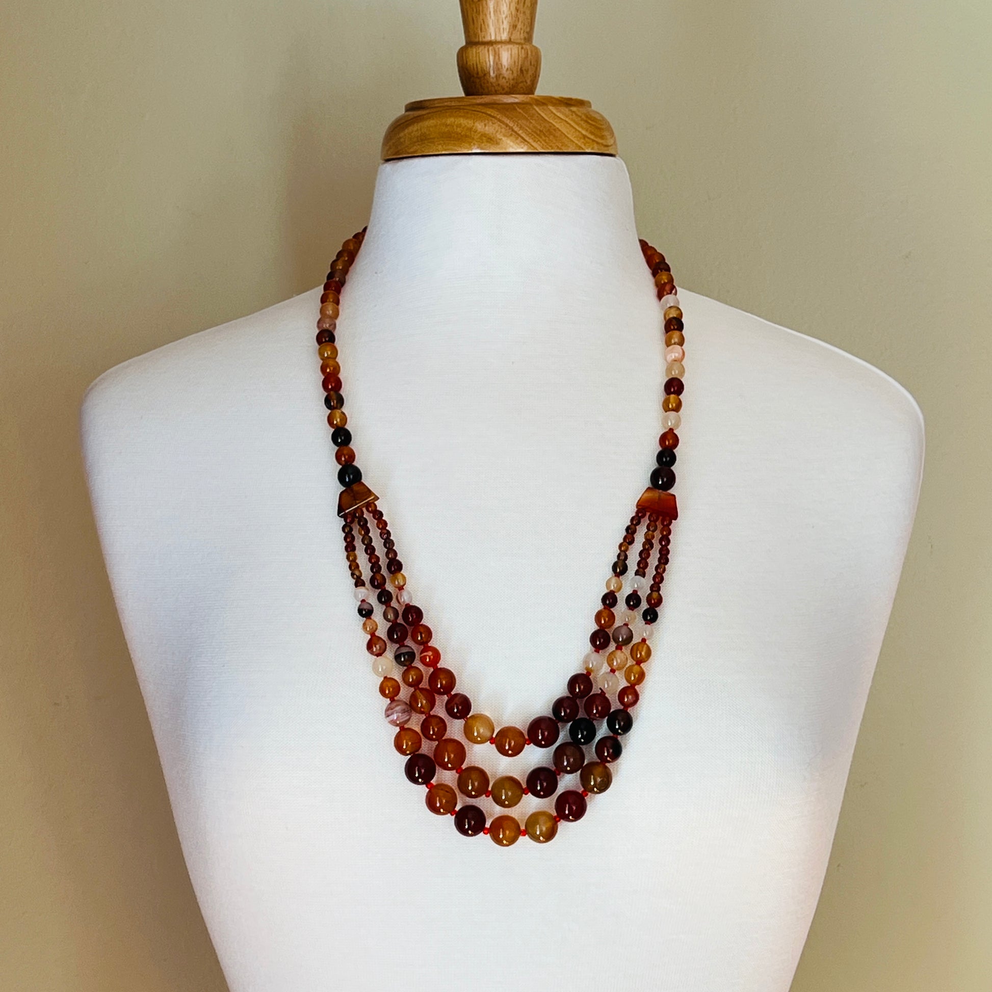 Long carnelian-toned graduated bead necklace with boho statement style