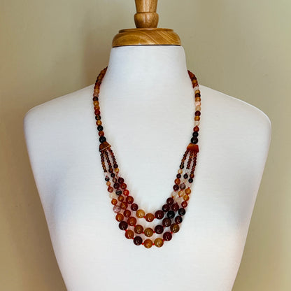 Long carnelian-toned graduated bead necklace with boho statement style