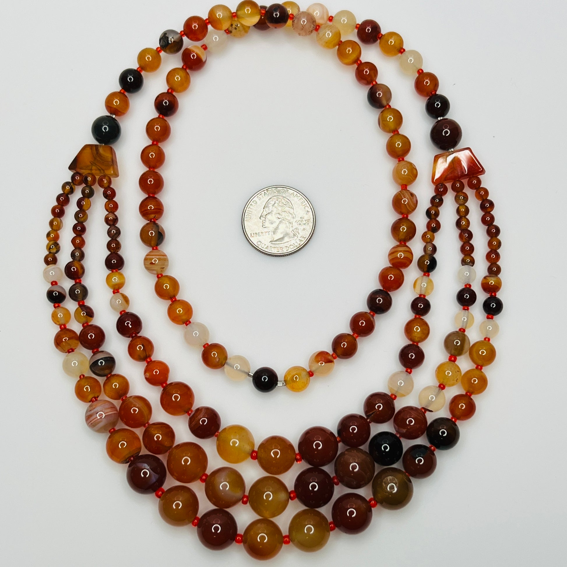 Earthy vintage beaded necklace with layered silhouette and rich color