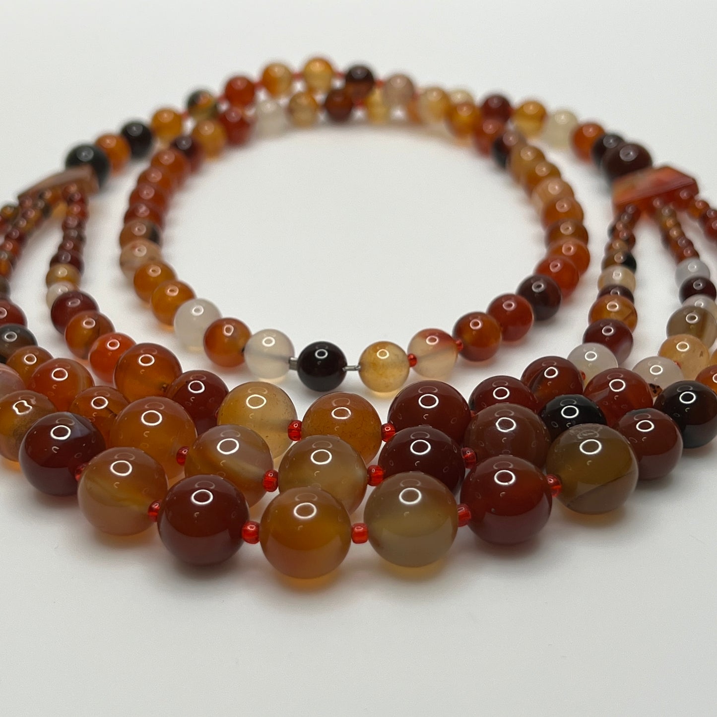 Triple strand vintage glass bead necklace in warm autumn tones