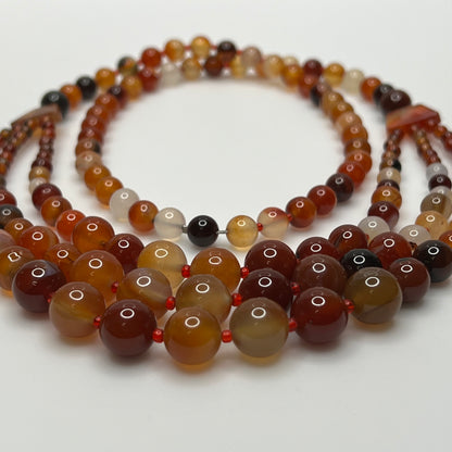 Triple strand vintage glass bead necklace in warm autumn tones