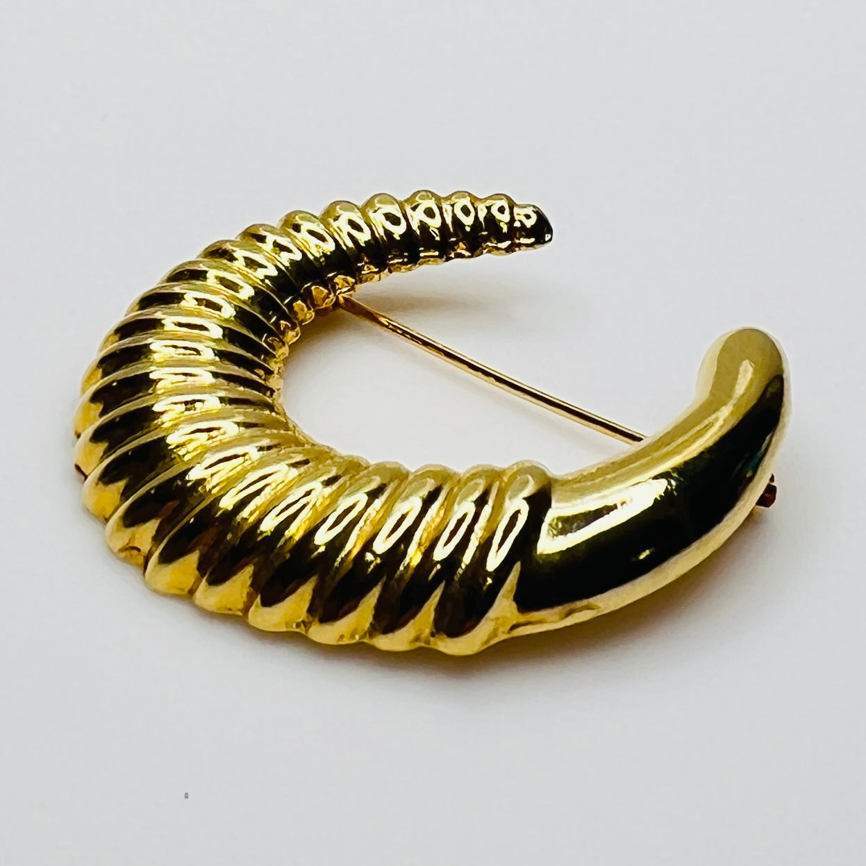 crescent moon brooch in polished gold finish