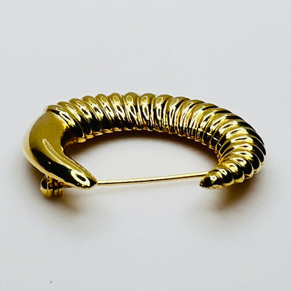 crescent moon brooch in polished gold finish
