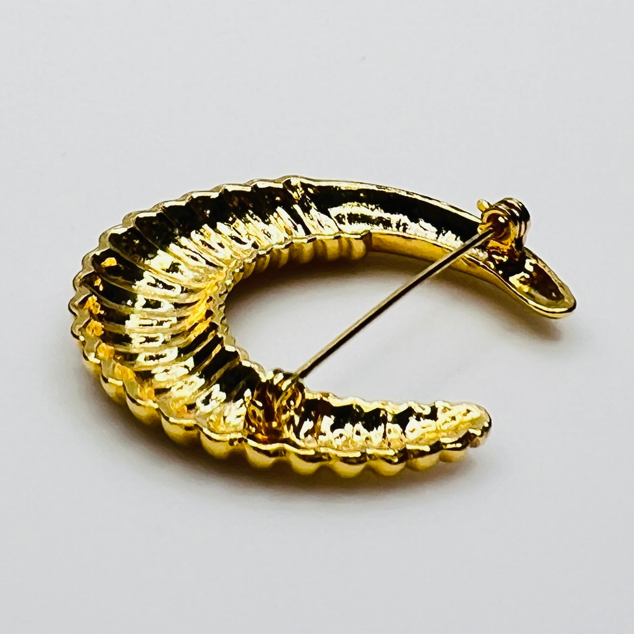 crescent moon brooch in polished gold finish
