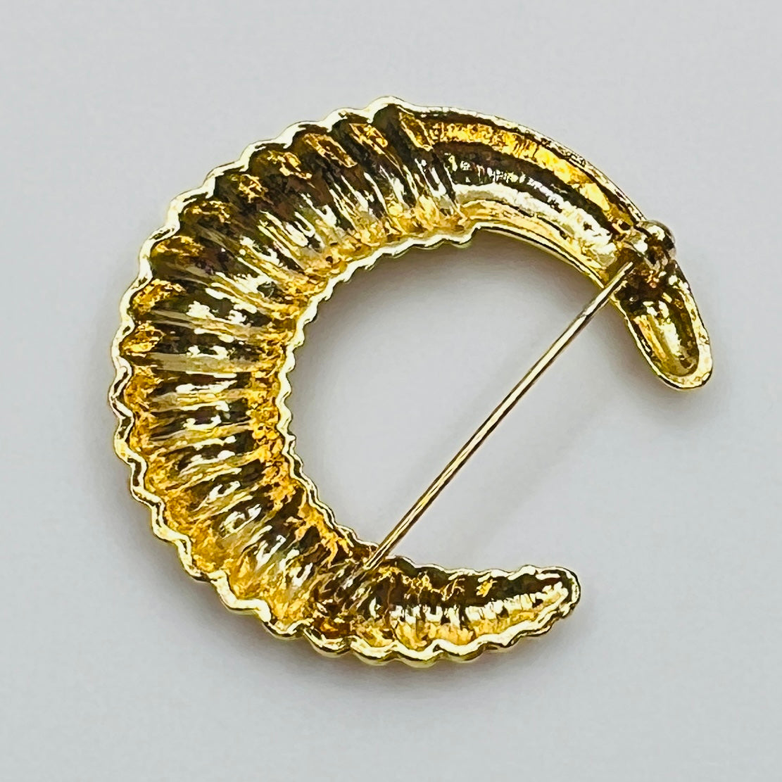 crescent moon brooch in polished gold finish