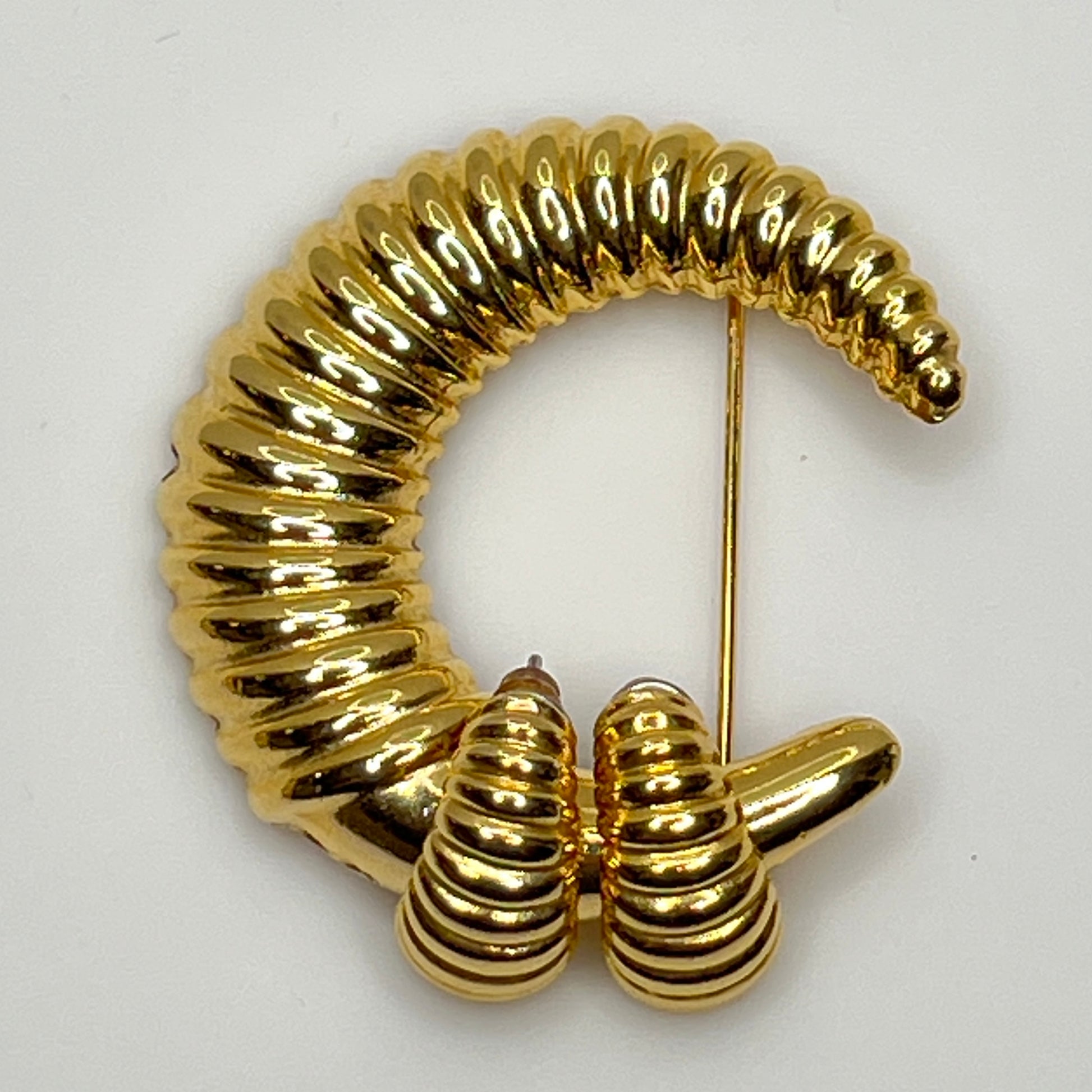 Vintage gold-tone crescent moon brooch with ribbed texture