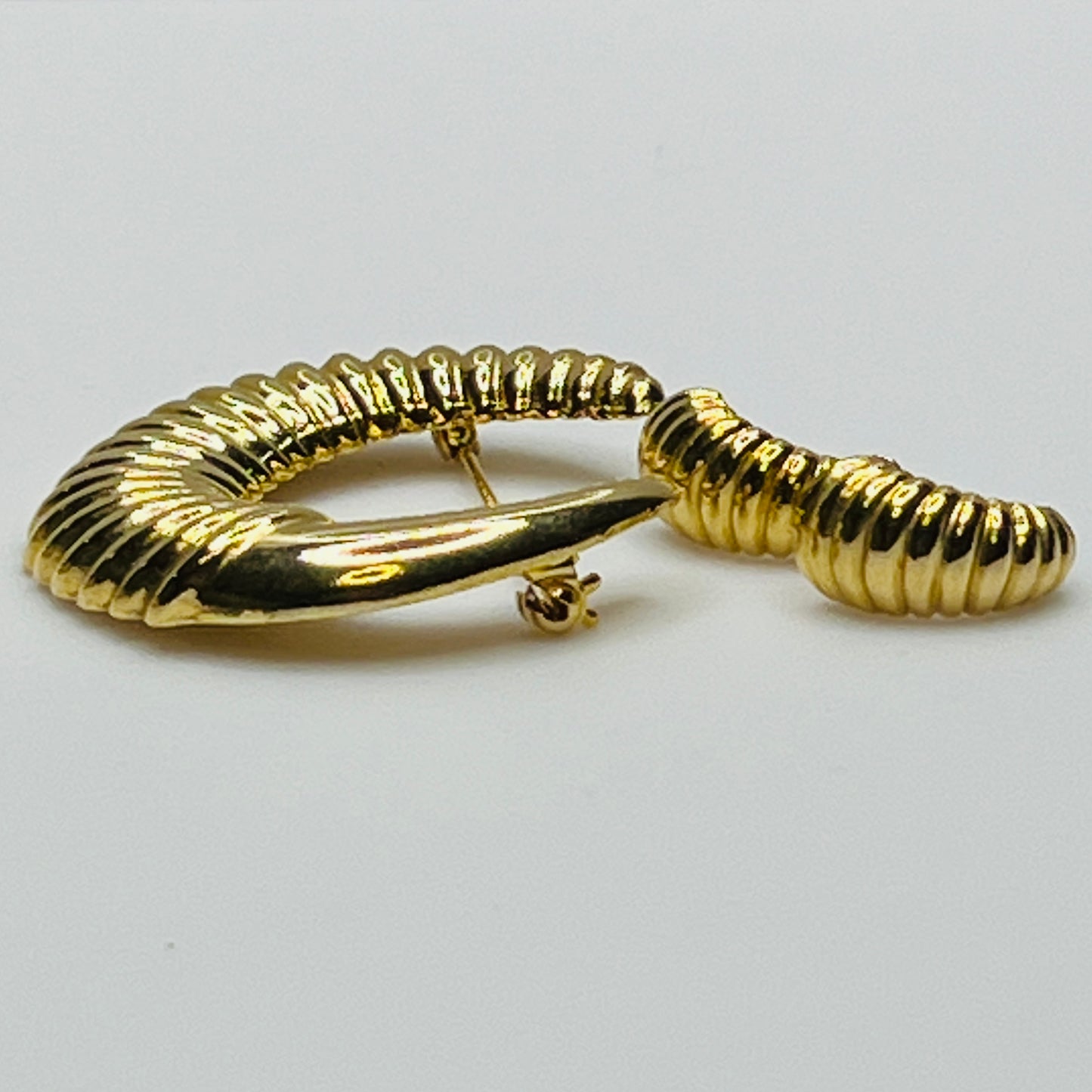 Vintage gold-tone crescent moon brooch with ribbed texture