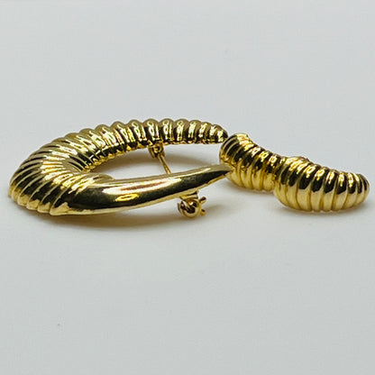 Vintage gold-tone crescent moon brooch with ribbed texture