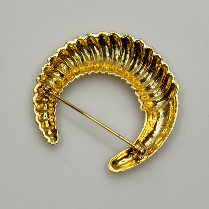 Vintage gold-tone crescent moon brooch with ribbed texture
