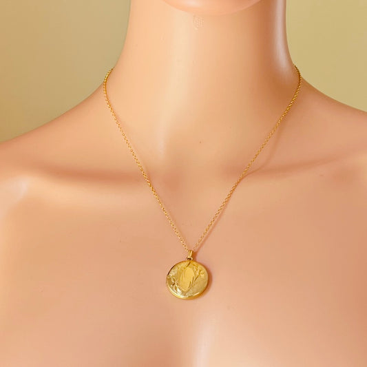 Gold locket necklace worn on mannequin 18 inch chain