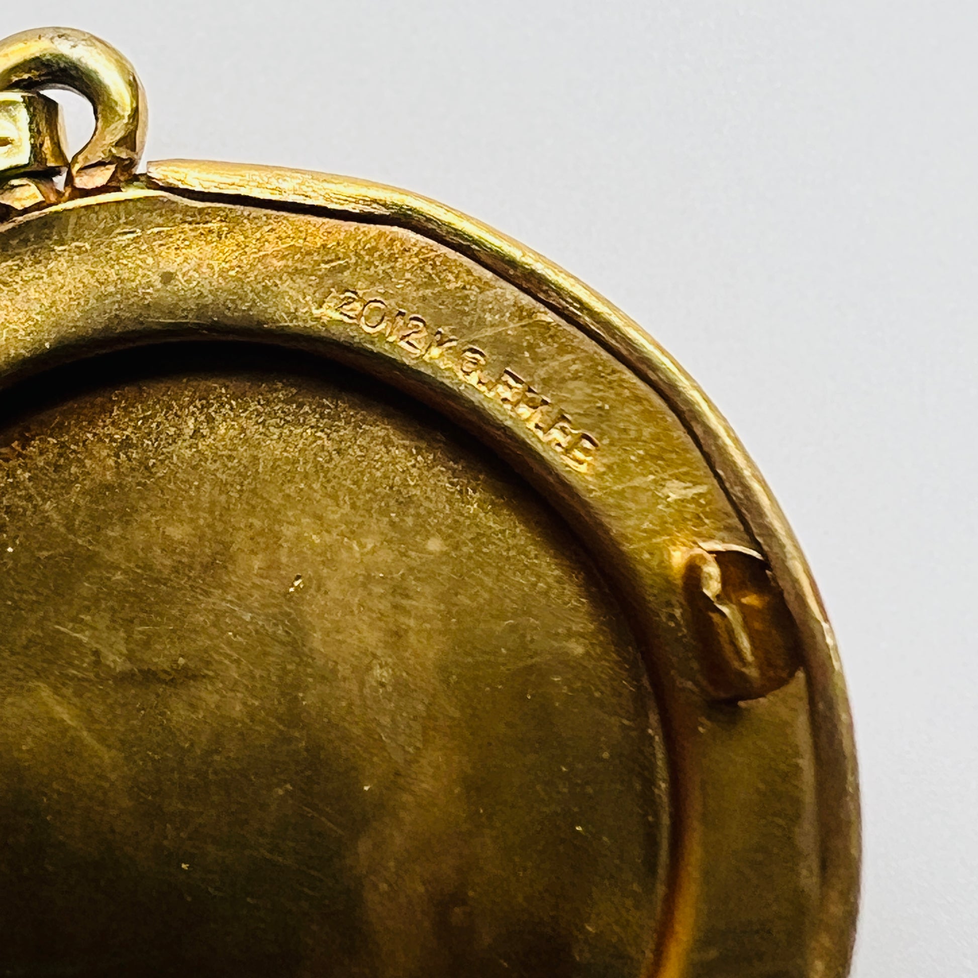 Inside rim stamp 12K gold filled H.F. Barrows locket