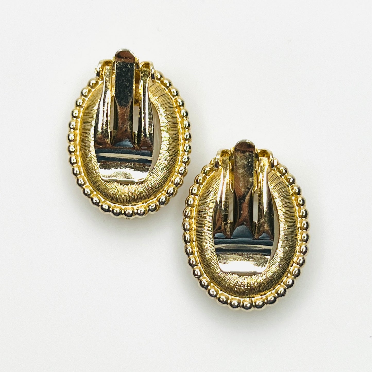Back view of vintage gold-tone cameo clip-on earrings