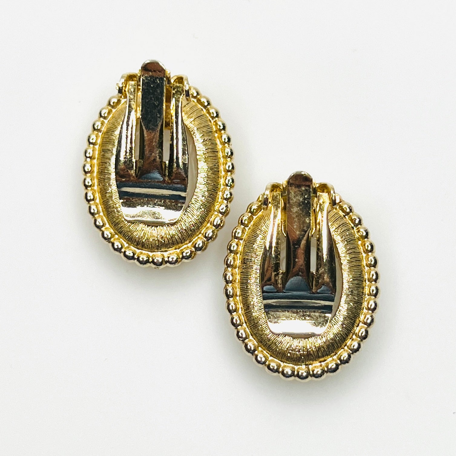 Back view of vintage gold-tone cameo clip-on earrings