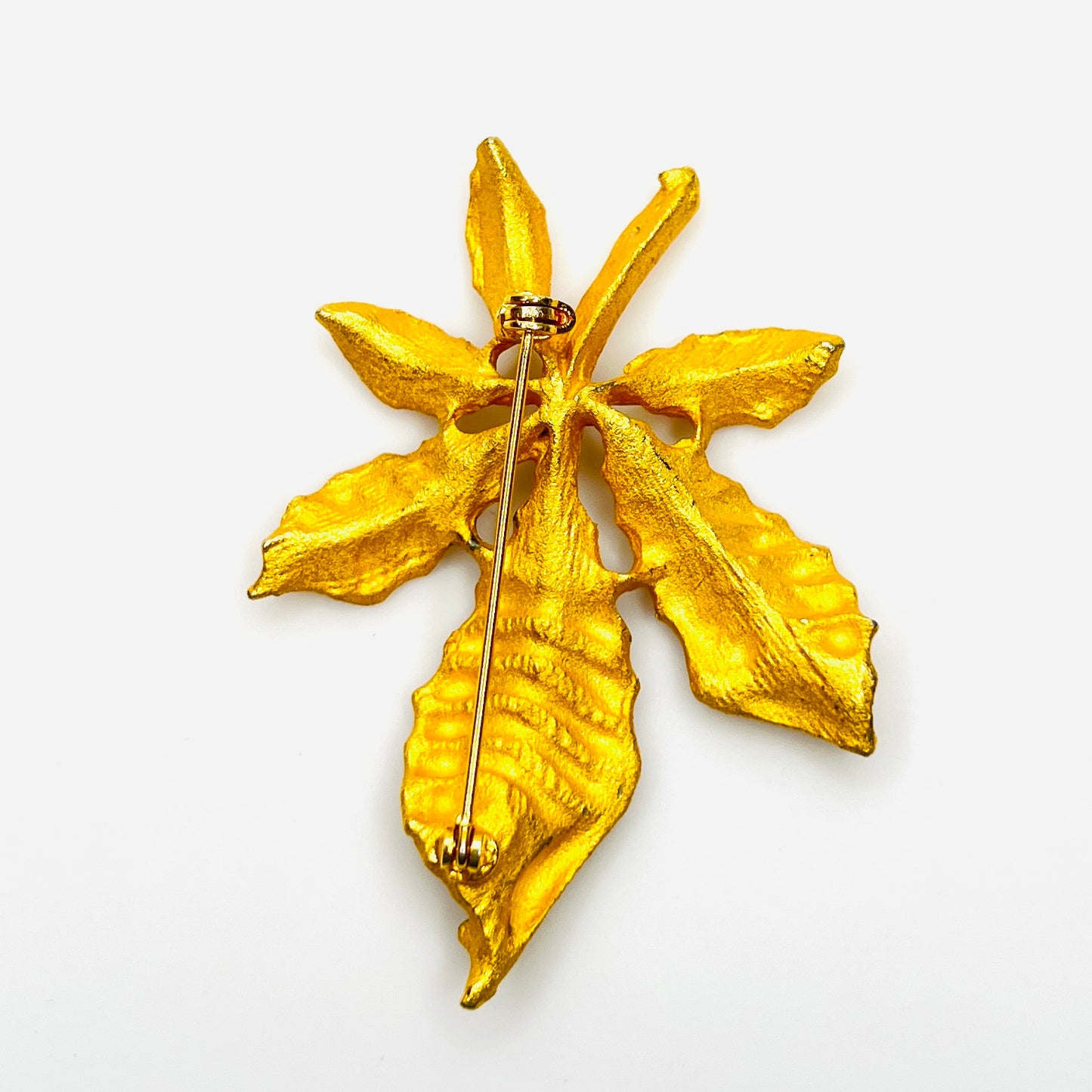 Back view of vintage 1950s gold tone leaf brooch with rollover clasp