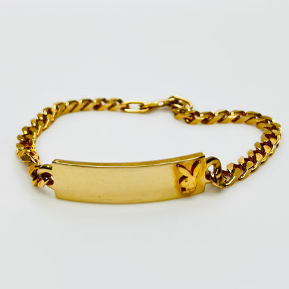 Gold tone chain bracelet with engraved Playboy Bunny plate
