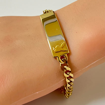 Vintage gold tone Playboy Bunny ID bracelet on wrist