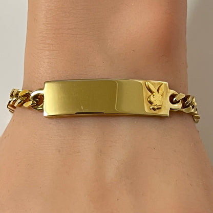Vintage gold tone Playboy Bunny ID bracelet on wrist