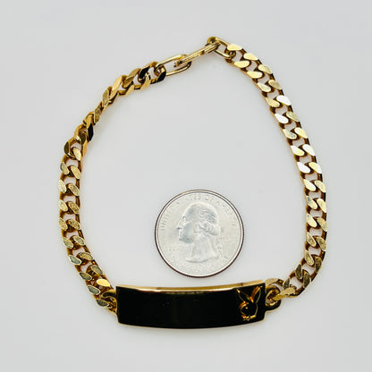 Gold tone chain bracelet with engraved Playboy Bunny plate