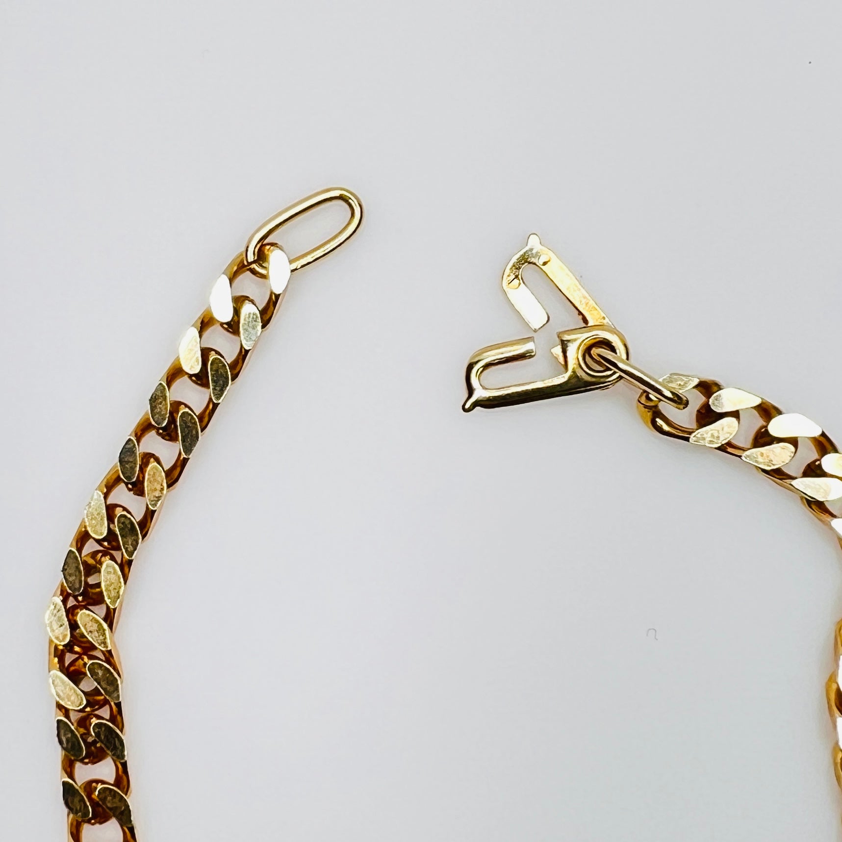 Close-up of hook clasp on vintage gold tone bracelet