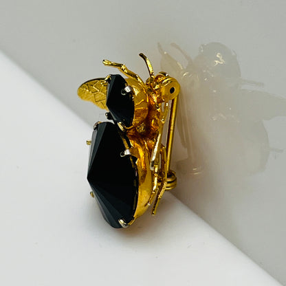 Gold-tone bee brooch with black faceted rhinestones, vintage insect pin