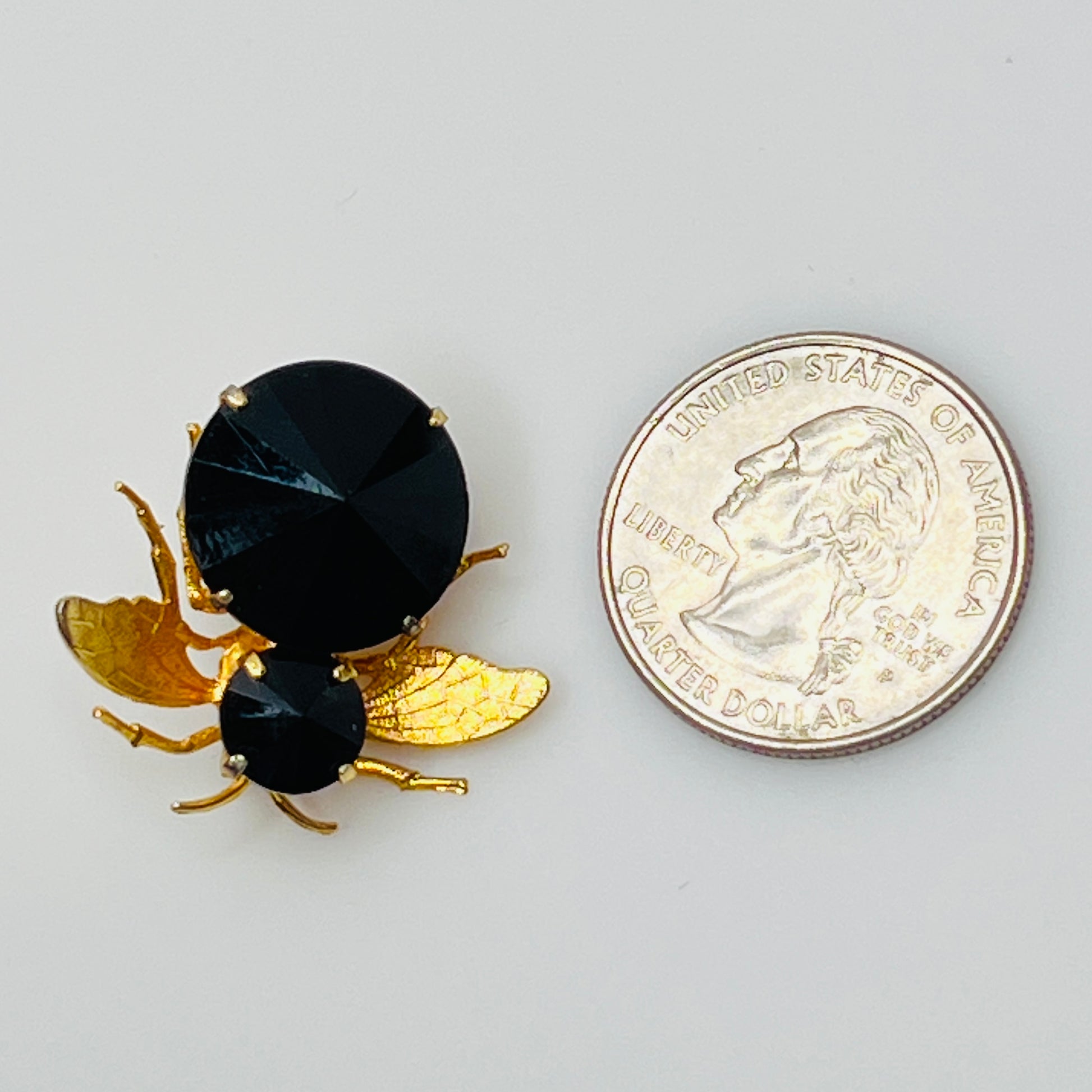 Gold-tone bee brooch with black faceted rhinestones, vintage insect pin