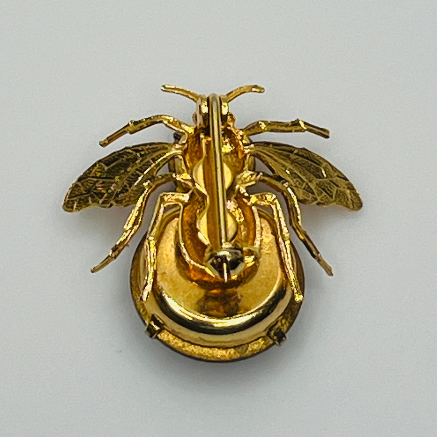 Gold-tone bee brooch with black faceted rhinestones, vintage insect pin