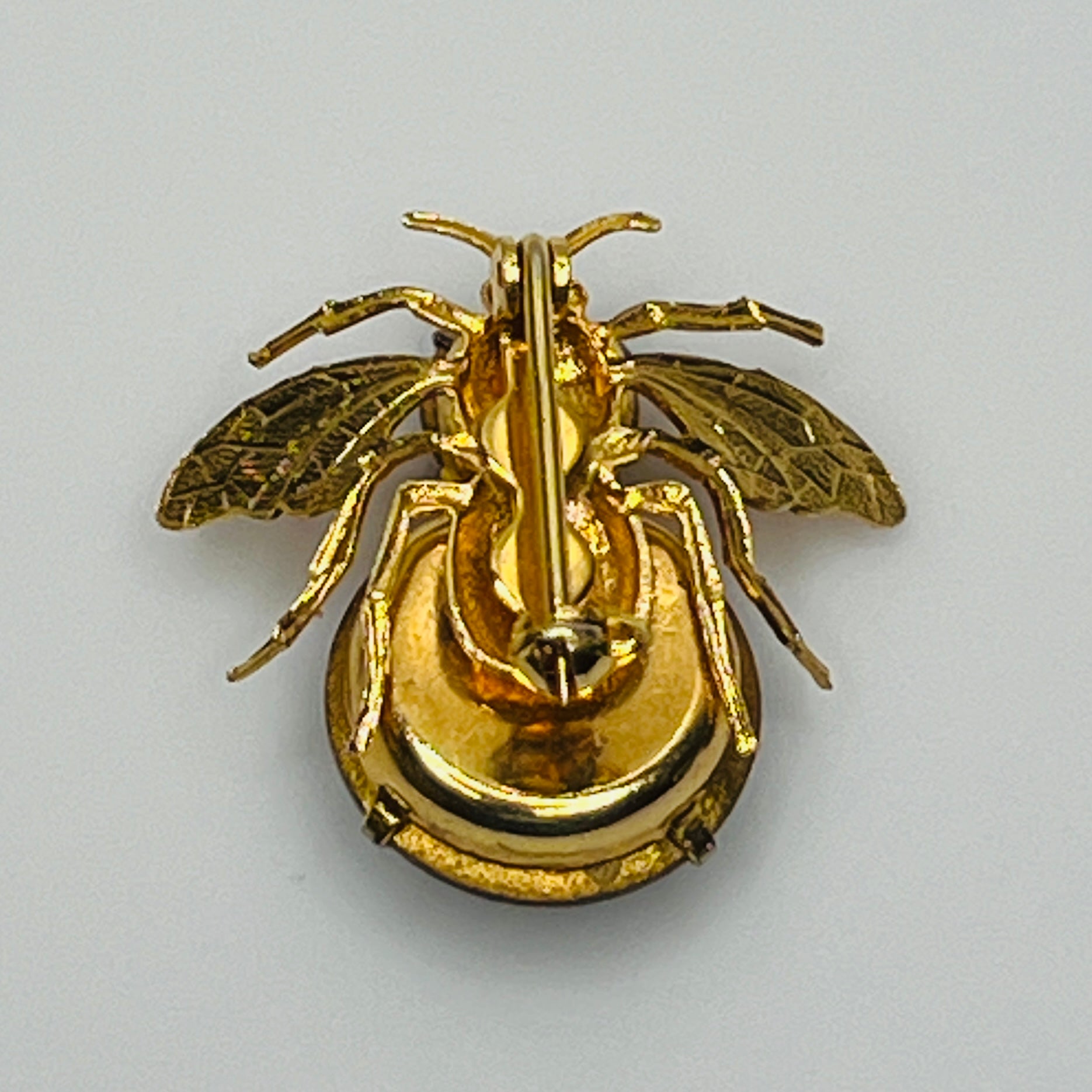 Gold-tone bee brooch with black faceted rhinestones, vintage insect pin