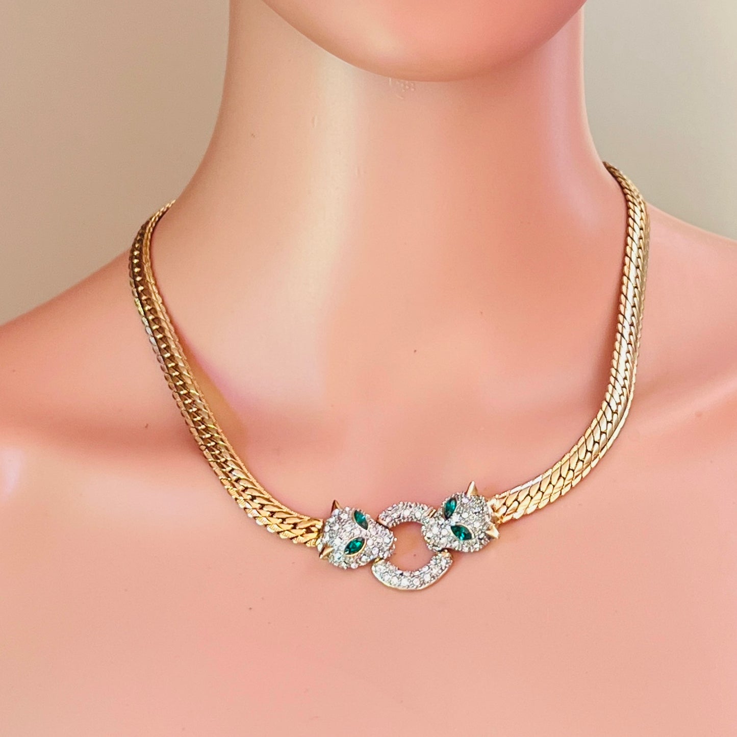 Vintage gold tone panther necklace with emerald green rhinestone eyes and herringbone chain