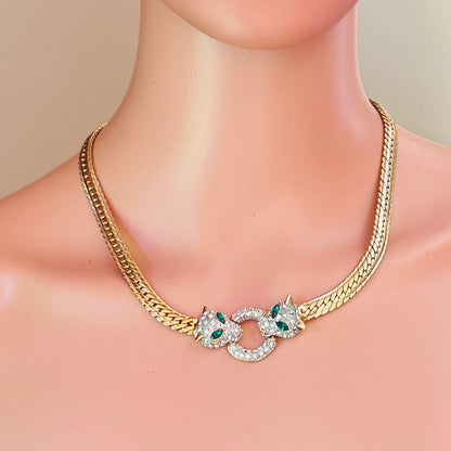Vintage gold tone panther necklace with emerald green rhinestone eyes and herringbone chain