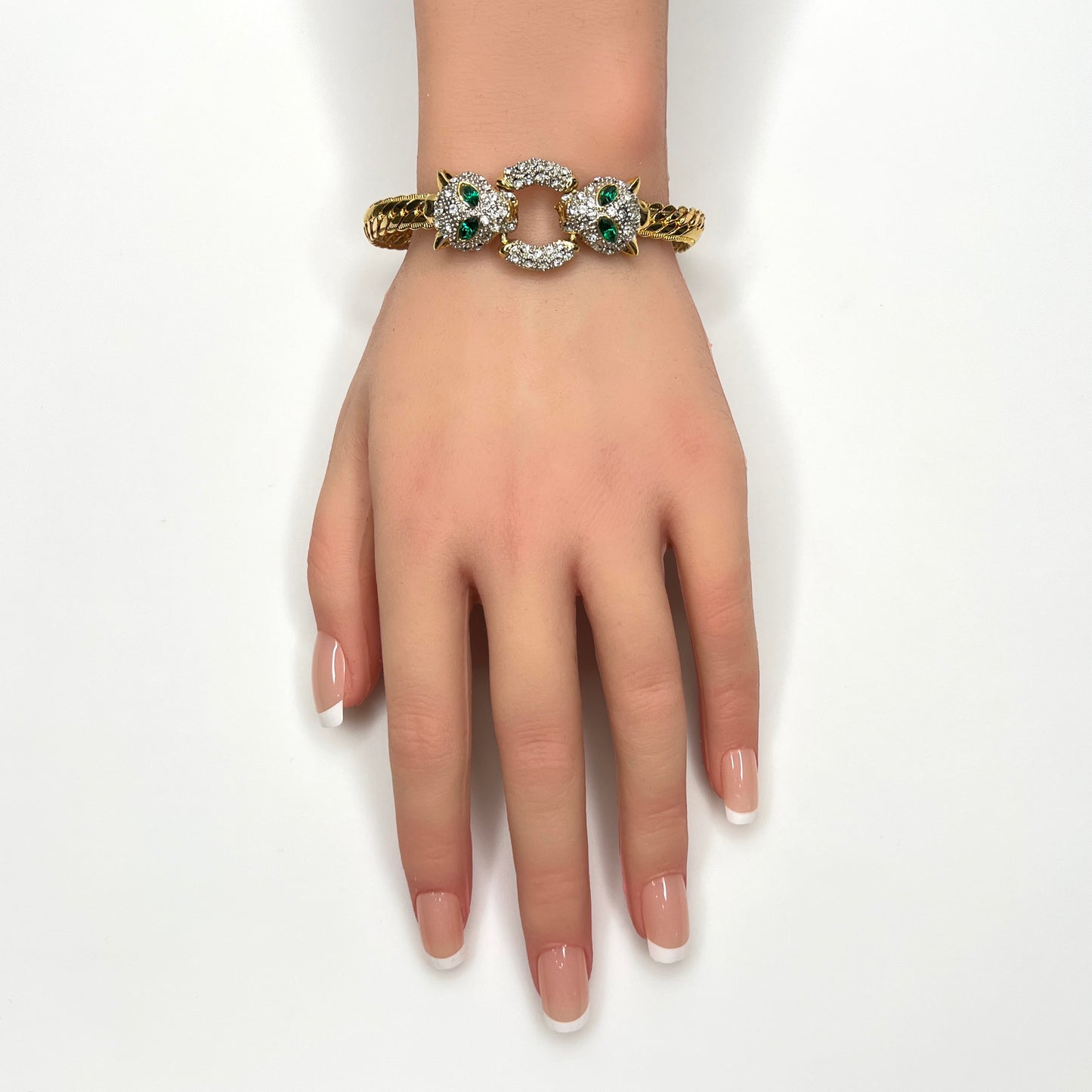 Matching vintage panther bracelet with clear rhinestones and emerald green crystal eyes