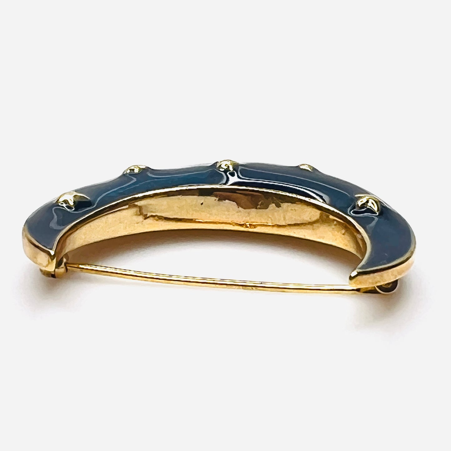 Side profile of vintage blue enamel crescent moon brooch with gold-tone finish.