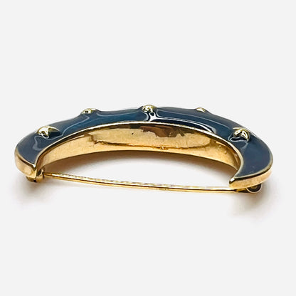 Side profile of vintage blue enamel crescent moon brooch with gold-tone finish.