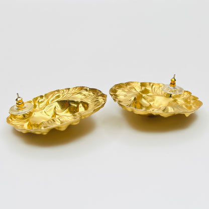 Side profile of vintage oversized lion head stud earrings