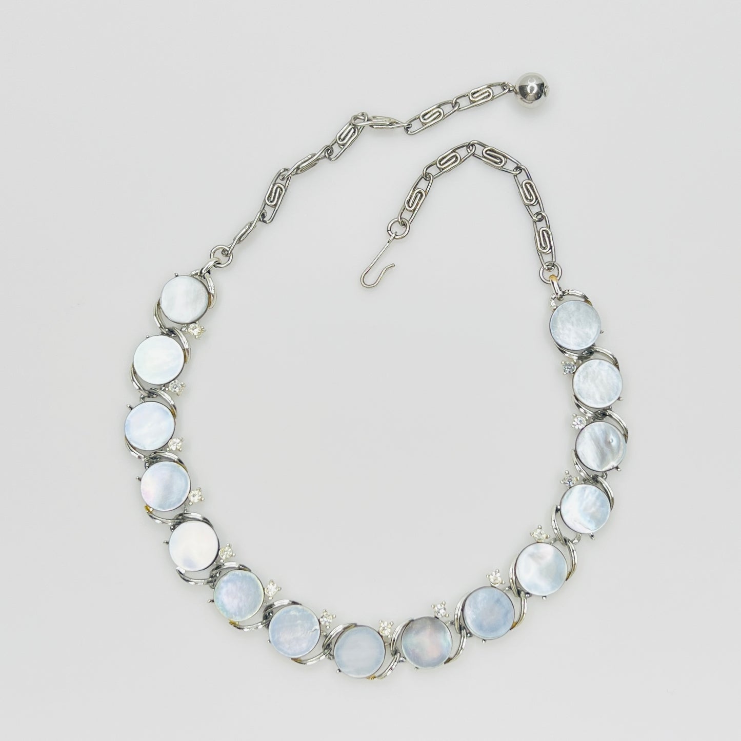 Vintage 1950s Lisner mother of pearl choker necklace with clear rhinestone accents