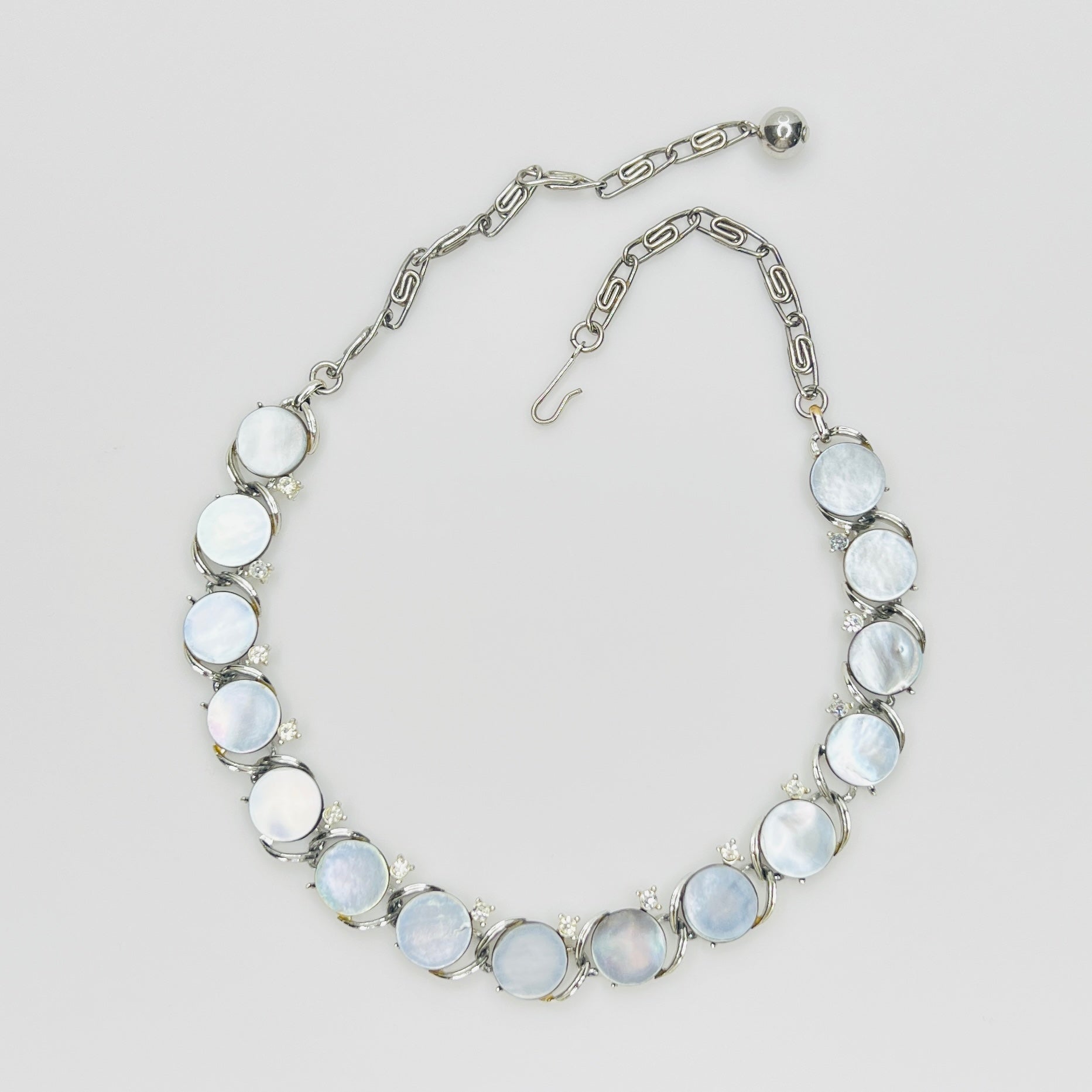 Vintage 1950s Lisner mother of pearl choker necklace with clear rhinestone accents