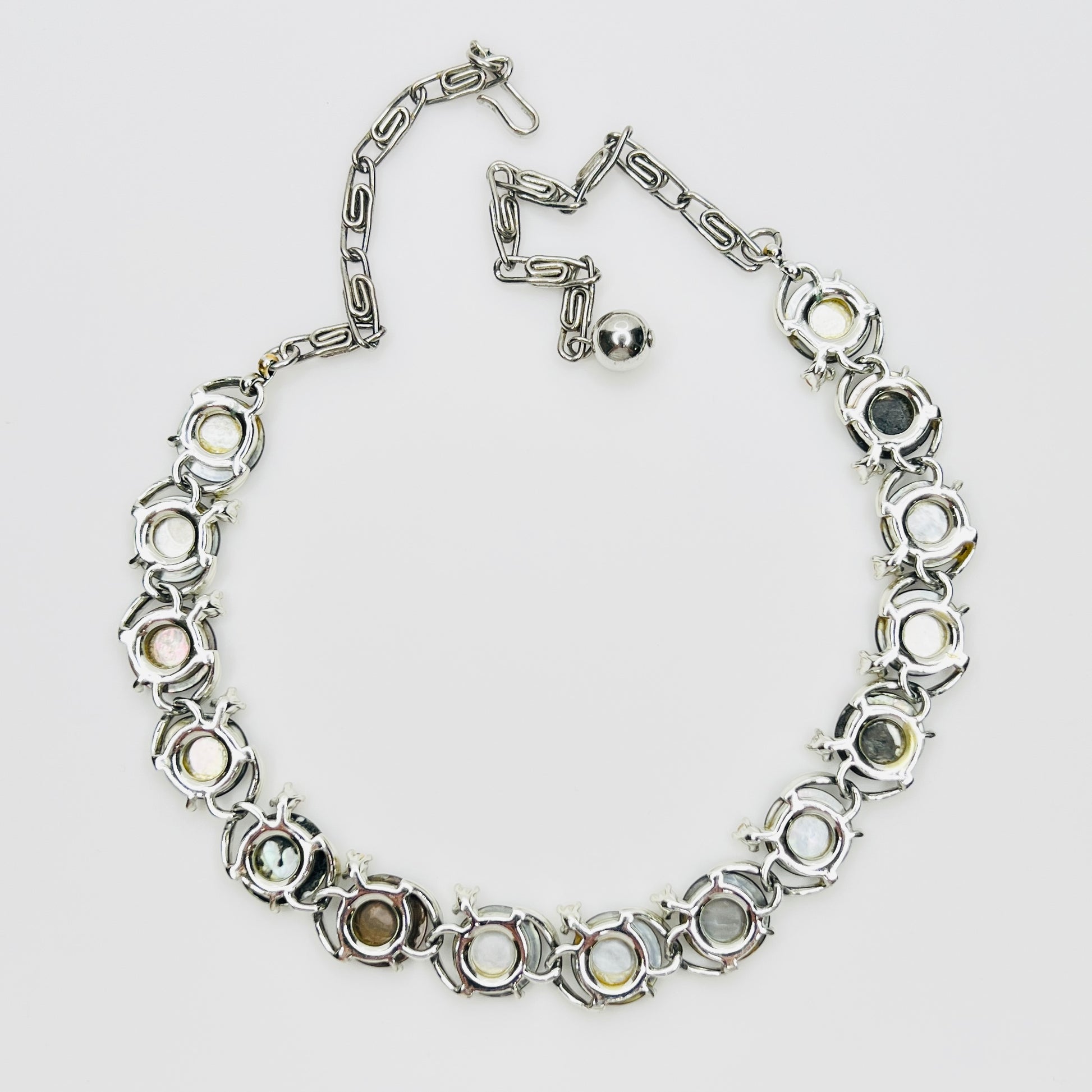 Back view of vintage Lisner mother of pearl choker necklace in silver tone setting
