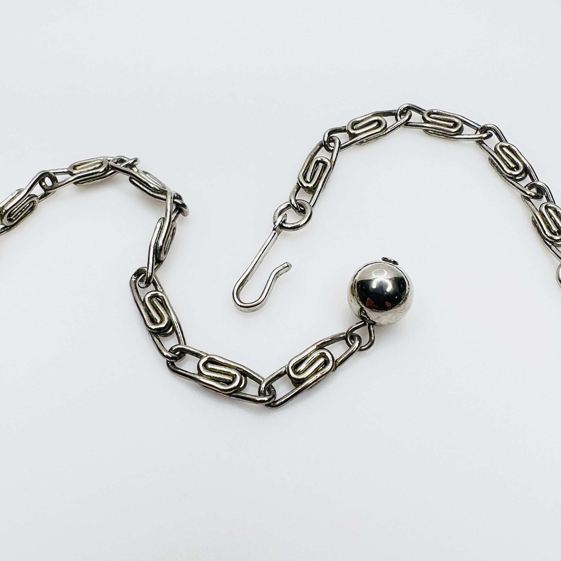 Original paperclip chain extension and signed hook clasp on vintage Lisner necklace