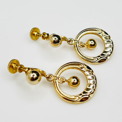 1960s gold tone circular dangle earrings with screw backs