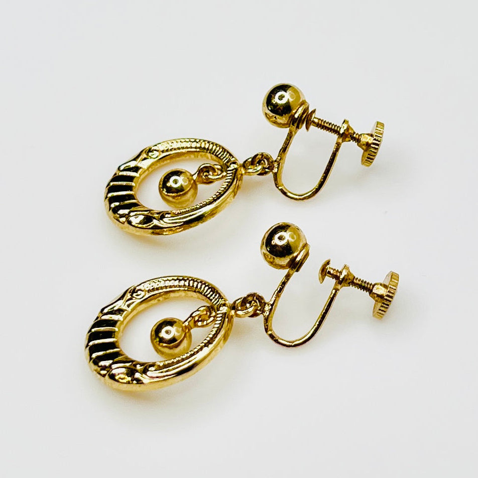 1960s gold tone circular dangle earrings with screw backs