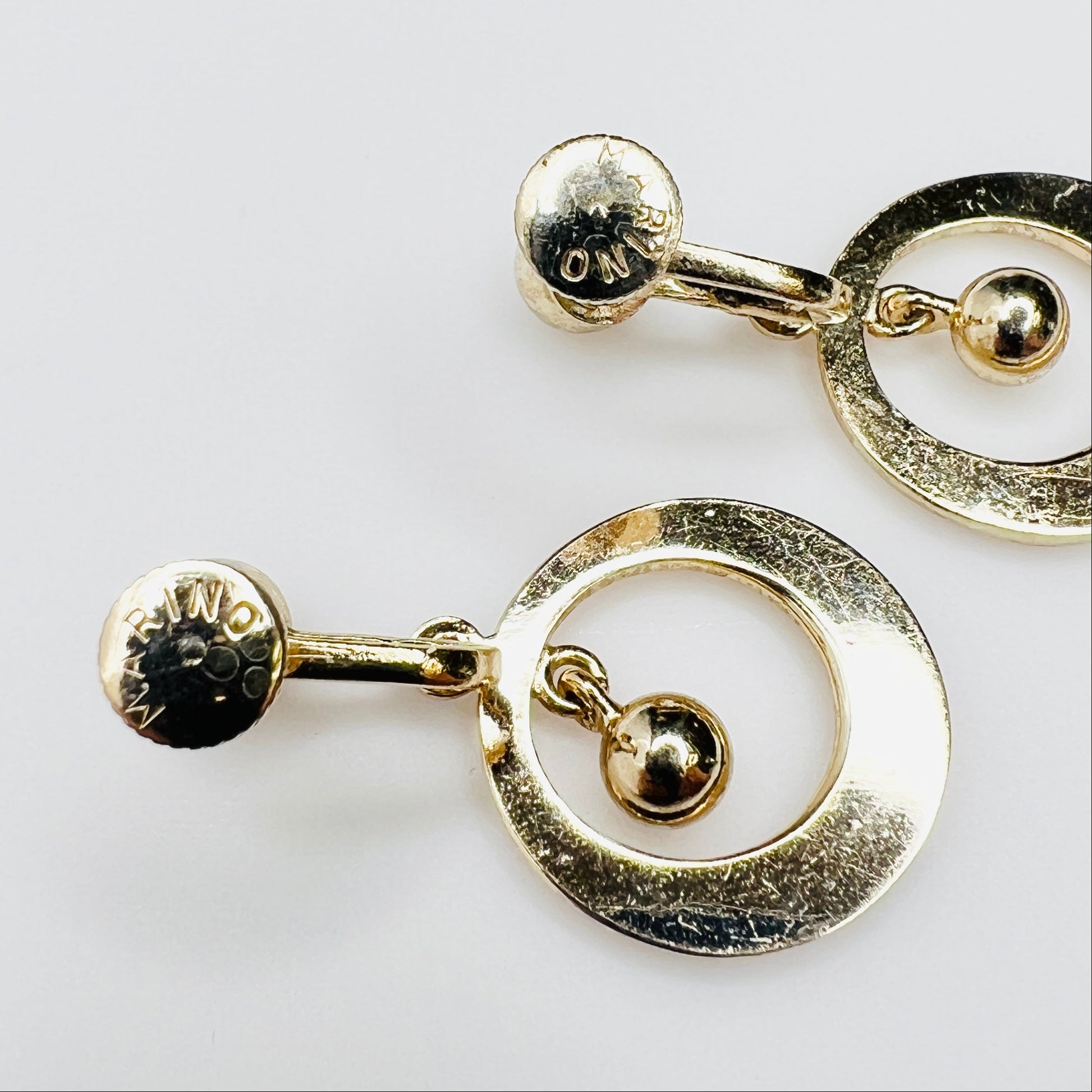 Signed Marino vintage gold tone earrings detail view